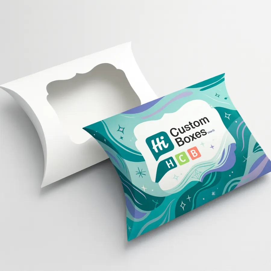 Two pillow-shaped gift boxes- one plain white and one with vibrant- branded graphics- class=